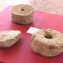 Tres molins manuals per moldre gra localitzats a indrets diferents del poblat que demostren el pes dels cereals a la dieta dels laietans  “santjustencs”.  